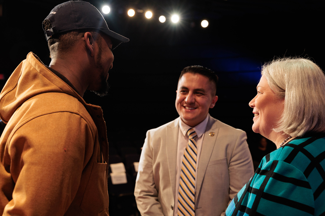 President Granberg on the right interacting with students