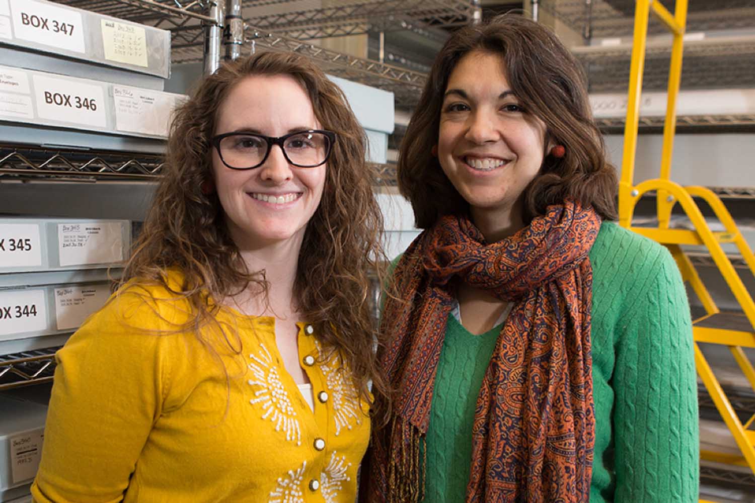 Two women smile for a photo together