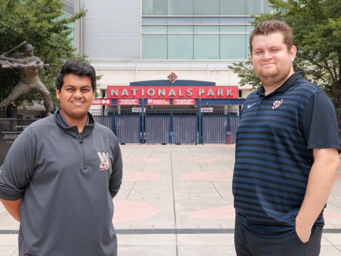 Jay Khurana (left) and Peter Lavan at Nationals Park. (William Atkins/GW Today)
