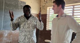 GW alumnus Liam Paup (r) is a Peace Corps volunteer in Benin, Africa.