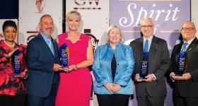 The 2025 Spirit of GW Award recipients with GW President Ellen M. Granberg. From left: Cheryl A. Thaxton, Gilbert R. Cisneros Jr., Jacki Cisneros, Ellen Granberg, Josh N. Kuriloff and Gregory S. Stevens. (Photo: Abby Greenawalt)